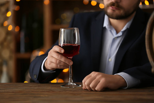 Man drinking wine in bar - Photo, Image