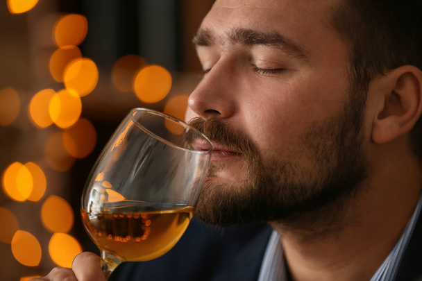 Man drinking wine in bar, closeup - Photo, Image