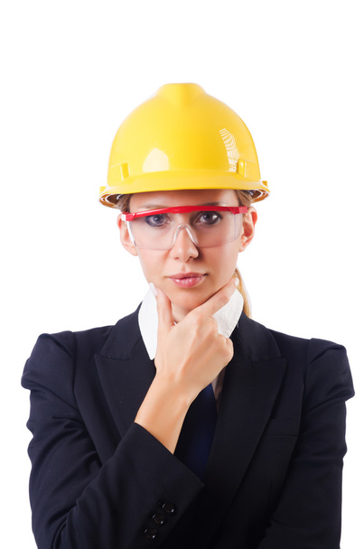 Young businesswoman with hard hat on white - Photo, Image