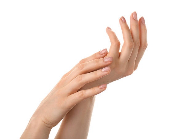 Female hands with nude manicure on white background - Photo, Image
