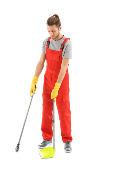 Man with dust pan and floor brush on white background - Φωτογραφία, εικόνα