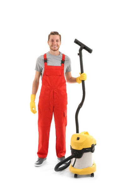 Man with vacuum cleaner on white background - Foto, Bild