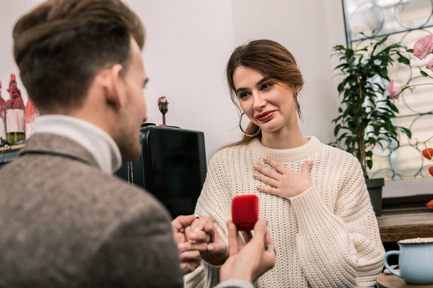 Woman feels happy while receiving a proposal - Фото, изображение