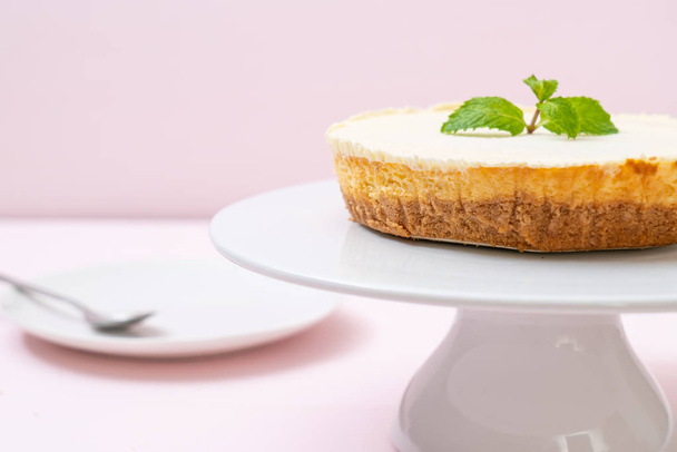 Homemade cheesecake  with mint on wood background - Foto, immagini