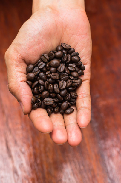 Coffee beans in hand - Photo, Image