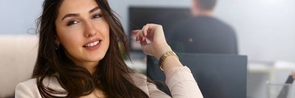 Beautiful smiling girl at workplace look in camera - Photo, Image