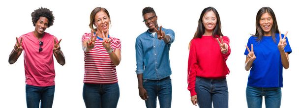 Composition of african american, hispanic and chinese group of people over isolated white background smiling looking to the camera showing fingers doing victory sign. Number two. - Photo, Image