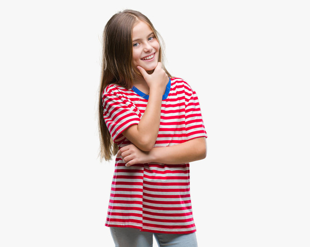 Young beautiful girl over isolated background looking confident at the camera with smile with crossed arms and hand raised on chin. Thinking positive. - Zdjęcie, obraz