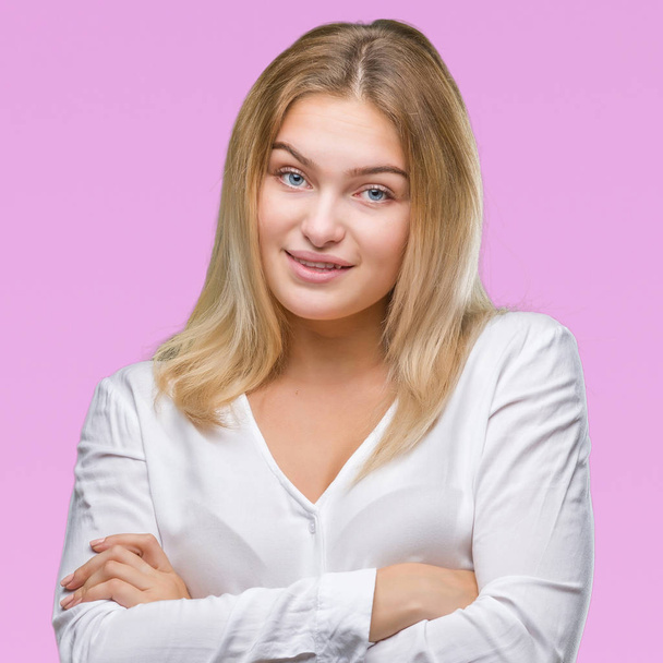 Young caucasian woman over isolated background happy face smiling with crossed arms looking at the camera. Positive person. - Фото, изображение
