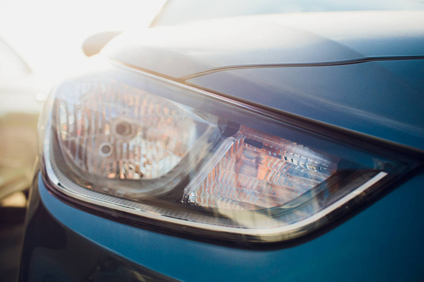 Car headlight with shallow depth field - Foto, imagen