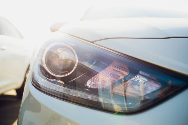 Car headlight with shallow depth field - Фото, изображение
