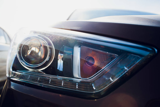Car headlight with shallow depth of field - Фото, изображение