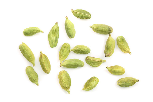 Green cardamom seeds isolated on white background. Top view. Flat lay - Photo, Image