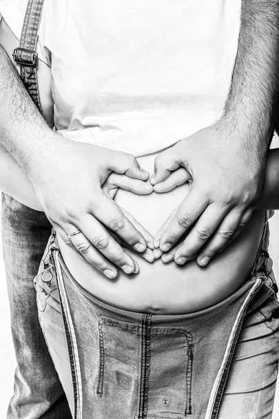 man embracing pregnant woman - Photo, image