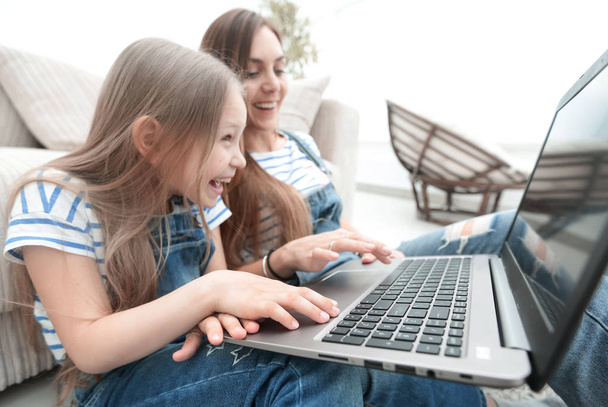happy mother with adorable little girl with laptop - Foto, Imagem