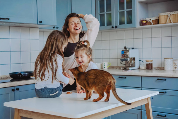 Happy family having fun in the kitchen - Photo, image