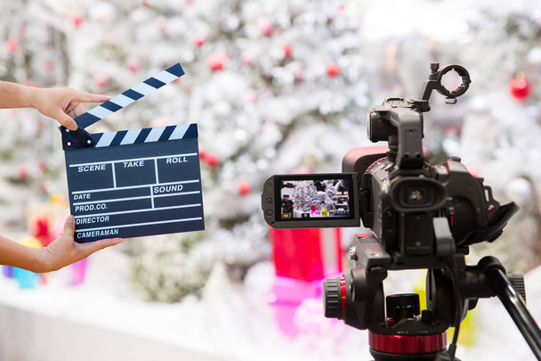 Man hands holding movie clapper.Film director concept.camera show viewfinder image catch motion in interview or broadcast Christmas Day, catch feeling, stopped motion in best memorial day concept. - Photo, Image