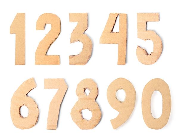 Set of cardboard numerals on white background, top view - Фото, изображение