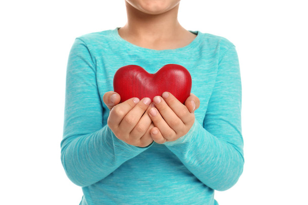 Boy holding decorative heart on white background, closeup - Фото, изображение