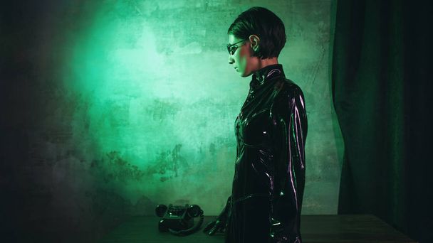 Young woman in matrix style suit, digital Internet technology and telecommunications, concept - Valokuva, kuva