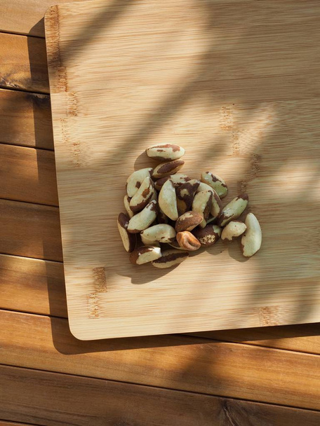 Brazil nuts on wooden boards - Foto, immagini