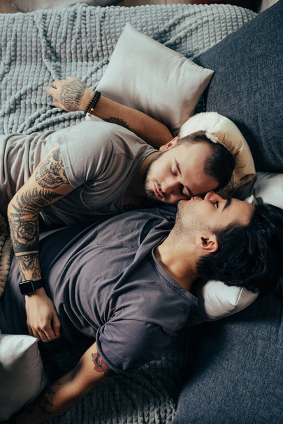 Positive delighted non-traditional couple sleeping together - Foto, Imagem