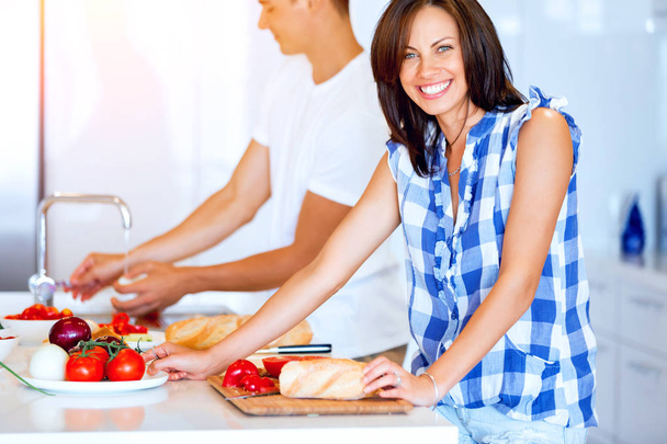 Couple cooking together at home - Photo, Image