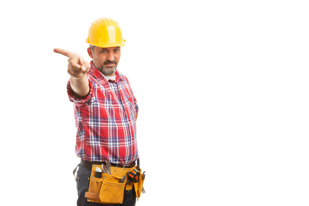 Construction foreman holding index finger as get out the door gesture with angry expression isolated on white - Photo, Image