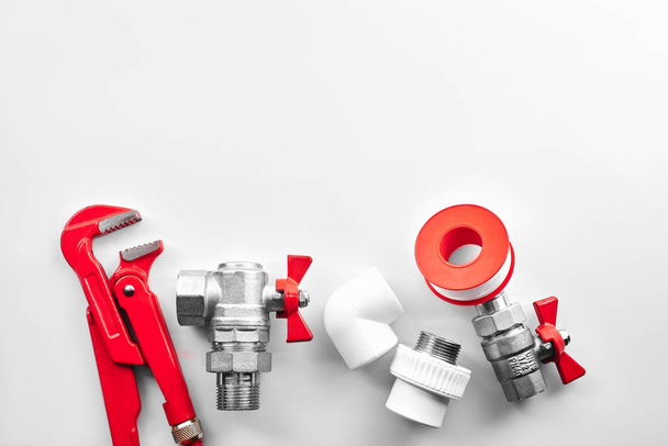 plumbing tools and equipment on a white background closeup with copy space - Фото, зображення
