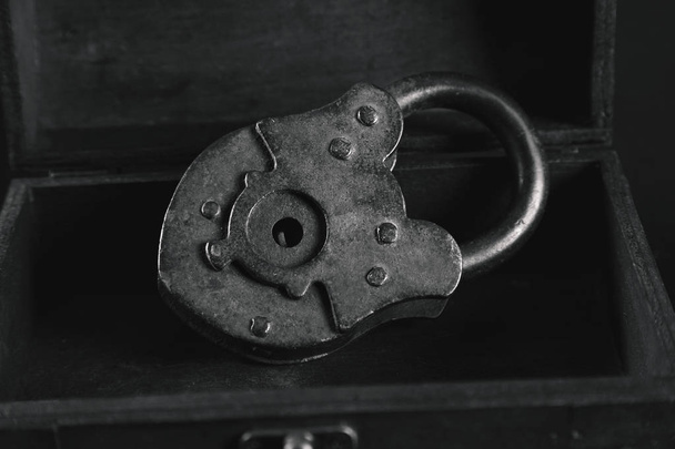 Vintage metal padlock in wooden box - Photo, Image