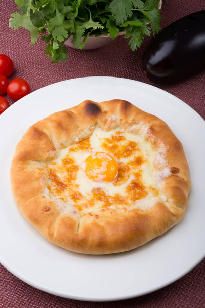 Georgian traditional flatbread served on white plate - Foto, Bild
