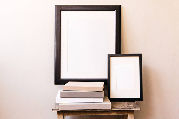Two empty wooden frame mockup. Interior poster design on white wall - Foto, afbeelding