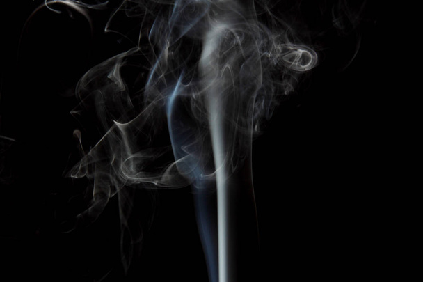 selective focus of smoke flowing on black background - Фото, изображение