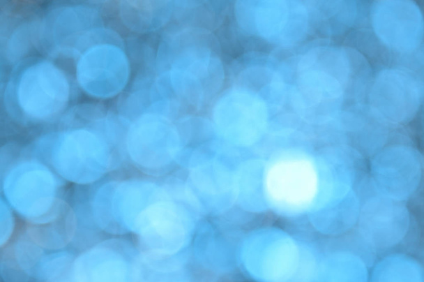 Blue colored abstract background with bokeh, for the new year and christmas - Φωτογραφία, εικόνα