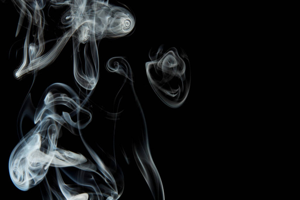 selective focus of smoke flowing on black background - Фото, зображення