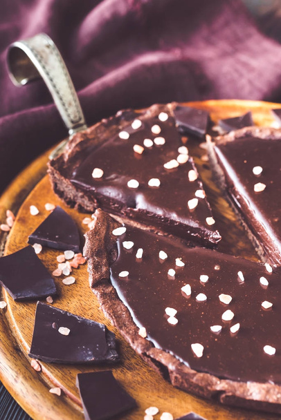 Chocolate salted tart close-up - Photo, Image