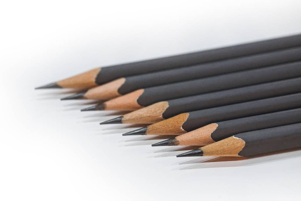 sharp grey pencils on white table background - Foto, afbeelding