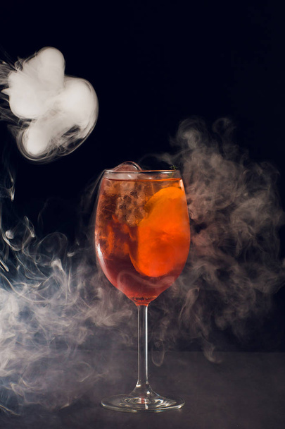 Beautiful cocktail isolated with dry ice smoke. - 写真・画像