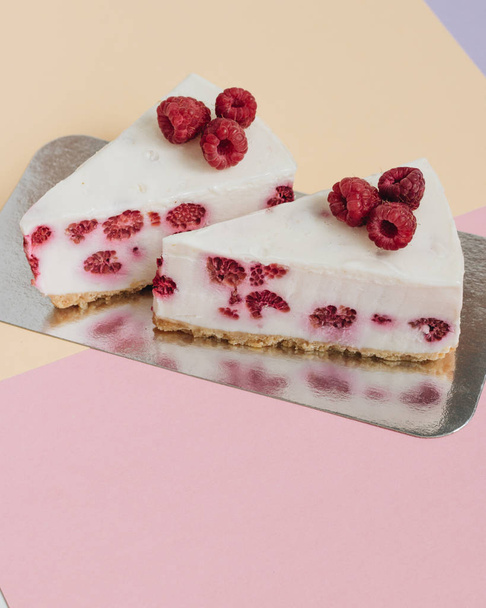 two pieces of delicious cake with raspberries, sweet dessert  - Photo, Image