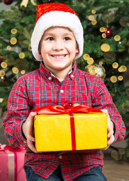 Christmas child with present box. - Fotó, kép