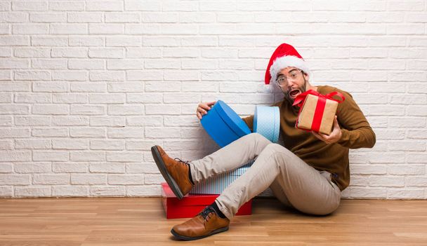 Young crazy man celebrating christmas in his house - Photo, Image
