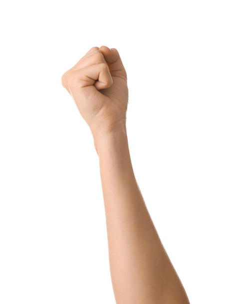Female hand with clenched fist on white background - Foto, afbeelding
