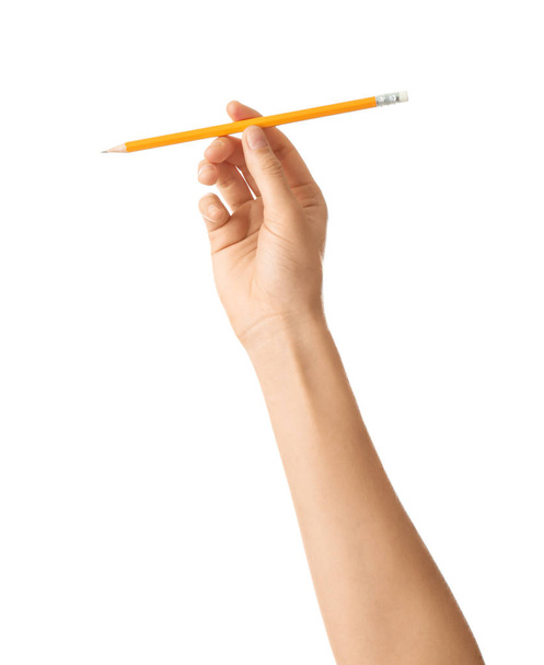 Main féminine avec crayon sur fond blanc
 - Photo, image