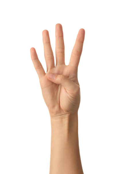 Mano femenina mostrando cuatro dedos sobre fondo blanco
 - Foto, Imagen
