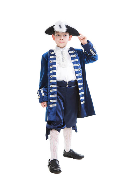 Smiling little boy wearing historical clothes. Isolated on white - Fotó, kép