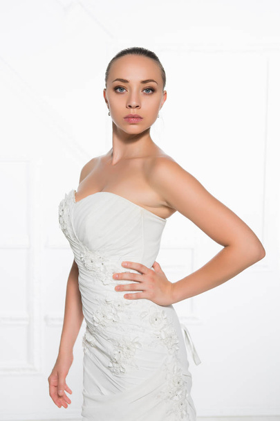charming young bride wearing white luxury wedding dress - Foto, imagen