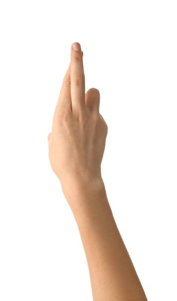 Female hand with crossed fingers on white background - Foto, Imagen