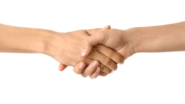 Young women shaking hands on white background - Foto, imagen