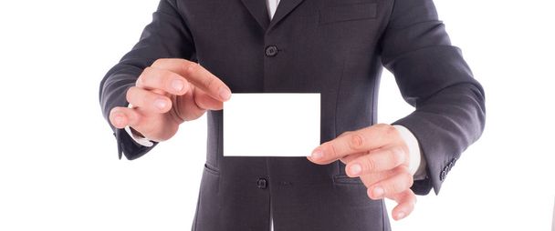 rajattu laukaus liikemies puku näyttää käyntikortti käsissä
 - Valokuva, kuva