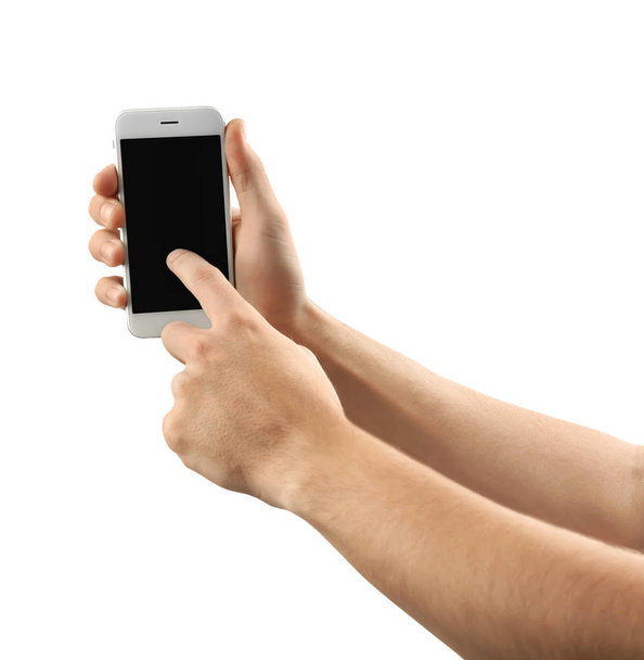 Joven sosteniendo teléfono móvil sobre fondo blanco
 - Foto, imagen
